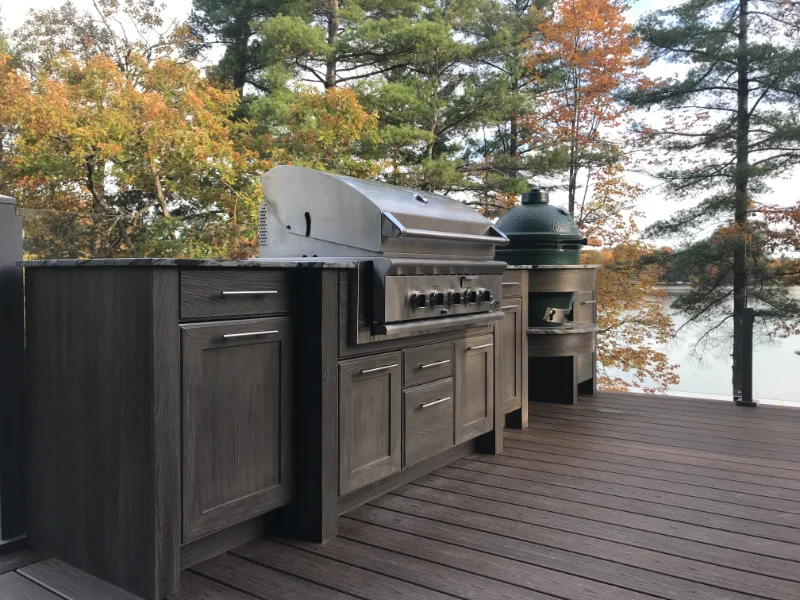 Outdoor kitchen area with naturekast cabinets